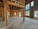 Unfinished living room showcasing exposed beams, multiple windows, and ample space at 7441 Fighting Creek Rd # 30, Sherrills Ford, NC 28673