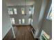 A view looking down into a spacious living area with a fireplace, large windows, and hardwood flooring at 7441 Fighting Creek Rd # 30, Sherrills Ford, NC 28673