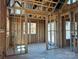 Living area shows wood framing, with open doorway and windows awaiting completion at 7441 Fighting Creek Rd # 30, Sherrills Ford, NC 28673