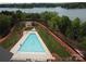 Birds eye view of a community pool near a lake, enhanced by landscaped greenery and accessible walking paths at 7441 Fighting Creek Rd # 30, Sherrills Ford, NC 28673