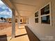 View of the front porch with white columns, offering a tranquil outdoor space at 7441 Fighting Creek Rd # 30, Sherrills Ford, NC 28673