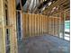 A framed room featuring wall supports and multiple windows, highlighting the initial stages of construction at 7441 Fighting Creek Rd # 30, Sherrills Ford, NC 28673