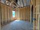 Newly framed room highlighting the bare framework with window placement, ready for further construction at 7441 Fighting Creek Rd # 30, Sherrills Ford, NC 28673