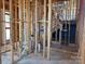 Stairwell shows wood framing, with open plumbing and mechanicals awaiting completion at 7441 Fighting Creek Rd # 30, Sherrills Ford, NC 28673