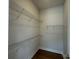 An empty walk-in closet with wire shelving and hardwood floors is move-in ready at 7441 Fighting Creek Rd # 30, Sherrills Ford, NC 28673