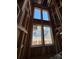 Tall window view shows the wooden structure and the neighborhood view, waiting for finishing at 7441 Fighting Creek Rd # 30, Sherrills Ford, NC 28673