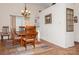 Cozy dining room featuring wood floors, a decorative chandelier, and natural light from the window at 9130 Twilight Hill Ct, Charlotte, NC 28277