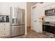 Well-equipped kitchen with stainless steel appliances, white cabinetry, and granite countertops at 9130 Twilight Hill Ct, Charlotte, NC 28277