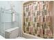 Bright bathroom with decorative shower curtain and functional shelving at 1035 Nw Wexford Pl # D3, Concord, NC 28027