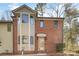 Charming brick townhome with multi-pane windows and a welcoming front entrance at 1035 Nw Wexford Pl # D3, Concord, NC 28027