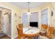 Cozy breakfast nook with a round table and window with natural light at 1035 Nw Wexford Pl # D3, Concord, NC 28027