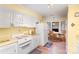Bright kitchen with white cabinets and a cozy breakfast nook at 1035 Nw Wexford Pl # D3, Concord, NC 28027