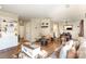 Open concept living room with wood floors, neutral walls, and comfortable seating at 1035 Nw Wexford Pl # D3, Concord, NC 28027