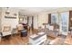Cozy living room with hardwood floors and a relaxing seating arrangement at 1035 Nw Wexford Pl # D3, Concord, NC 28027