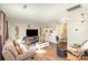 Spacious living room with hardwood floors and comfortable seating arrangement at 1035 Nw Wexford Pl # D3, Concord, NC 28027
