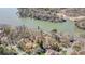 Aerial view showcases lakefront homes, docks, lush landscaping, and calm waters at 11 Courageous St, Lake Wylie, SC 29710