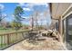 Back deck with a table and chairs and lake views, perfect for outdoor dining at 11 Courageous St, Lake Wylie, SC 29710