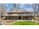 Two story house with a wooden deck, brick exterior and a green lawn at 11 Courageous St, Lake Wylie, SC 29710