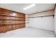 Spacious basement with wood-paneled walls and built-in shelving for ample storage at 11 Courageous St, Lake Wylie, SC 29710
