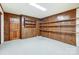 Finished basement area features wood-paneled walls, built-in shelves and convenient door at 11 Courageous St, Lake Wylie, SC 29710