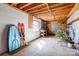 Unfinished basement with exposed ceiling, window and stored sports equipment at 11 Courageous St, Lake Wylie, SC 29710
