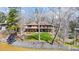 Multi-level brick home with a spacious deck overlooking the landscaped yard and waterfront at 11 Courageous St, Lake Wylie, SC 29710