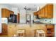 Kitchen bar with wooden stools and granite countertops at 11 Courageous St, Lake Wylie, SC 29710