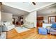 Open living room area with hardwood floors, cozy seating, and easy access to kitchen at 11 Courageous St, Lake Wylie, SC 29710