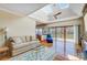 Bright living room with skylights, hardwood floors, and lake view from sliding doors at 11 Courageous St, Lake Wylie, SC 29710