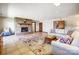 Cozy living room with a fireplace, comfortable seating, and tile flooring at 11 Courageous St, Lake Wylie, SC 29710