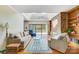 Spacious living room with skylights, brick fireplace, hardwood floors, and water views at 11 Courageous St, Lake Wylie, SC 29710
