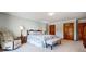 Spacious main bedroom with neutral-colored carpet, a large closet, and an ensuite bathroom at 11 Courageous St, Lake Wylie, SC 29710