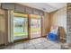 Comfortable chair on the patio shows the stunning lake view through sliding glass doors at 11 Courageous St, Lake Wylie, SC 29710