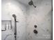 Shower with white marble style tile and rainfall shower head at 11 Courageous St, Lake Wylie, SC 29710