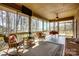 Comfortable sunroom featuring wicker seating and scenic backyard views at 11 Courageous St, Lake Wylie, SC 29710