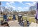 Inviting back deck with outdoor seating, grill, and views of the spacious backyard at 110 Weeping Willow Way, Gastonia, NC 28052