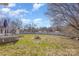 Expansive backyard with a well-maintained lawn, privacy fence, and access to the deck at 110 Weeping Willow Way, Gastonia, NC 28052