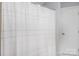 Clean bathroom showcasing a stylish shower curtain and a white door at 110 Weeping Willow Way, Gastonia, NC 28052
