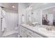 Bathroom with double sinks, white cabinets, and a large mirror at 110 Weeping Willow Way, Gastonia, NC 28052
