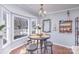 Cozy breakfast nook featuring hardwood floors, a round table with seating, and a bright bay window at 110 Weeping Willow Way, Gastonia, NC 28052