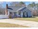 Charming home with a well-manicured front yard, a ramp, and an inviting entrance at 110 Weeping Willow Way, Gastonia, NC 28052