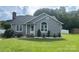Charming single-story home with gray siding, well-maintained lawn and a classic brick chimney at 110 Weeping Willow Way, Gastonia, NC 28052