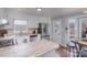 Well-equipped kitchen with white cabinetry, stainless steel appliances, stone countertops, and hardwood floors at 110 Weeping Willow Way, Gastonia, NC 28052