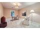 Comfortable bedroom furnished with a desk, chair, and an accent chair and side table at 121 Wonderwood Dr, Charlotte, NC 28211