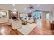Inviting living room featuring a brick fireplace and views into the kitchen and dining area at 121 Wonderwood Dr, Charlotte, NC 28211
