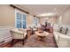 Elegant living room with hardwood floors and a view into dining area with lots of natural light at 121 Wonderwood Dr, Charlotte, NC 28211