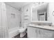 Bright bathroom featuring marble tiles, a shower-tub combo, and granite countertops at 1323 Queens Rd # 218, Charlotte, NC 28207