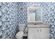 Charming half-bathroom with butterfly wallpaper, white vanity, and granite countertop at 1323 Queens Rd # 218, Charlotte, NC 28207