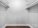 Walk-in closet with built-in shelving, perfect for organization and storage at 1323 Queens Rd # 218, Charlotte, NC 28207