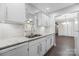 Modern kitchen with granite countertops, subway tile backsplash, and stainless steel sink at 1323 Queens Rd # 218, Charlotte, NC 28207